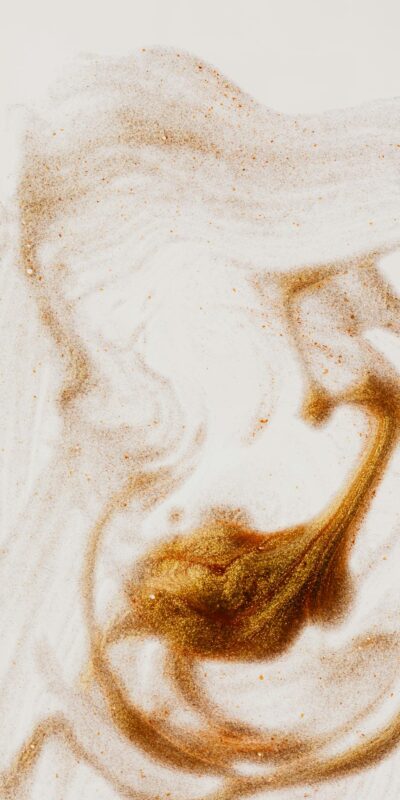 Abstract textured surface of picture made of brown paint on white sheet